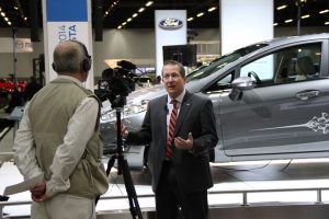 Ford Canada marketing manager Scott Kuzma is interviewed by David Dodge at the Edmonton Auto Show.