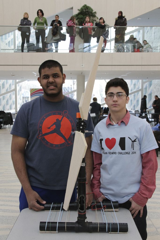 Akeel Kahn and Malek Hatamleh with their balsa wood wind turbine, the second place design at the KidWind Challenge in Edmonton. 