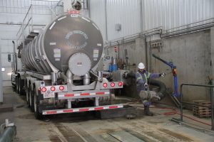 A truck of mature slurry unloads at the Lethbridge Biogas plant. The manure is mixed with high energy organic food waste and Lethbridge Biogas cooks the waste, harvests methane gas and then generates clean electricity with the gas.