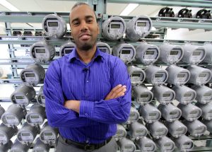 Wilbur McLean, a communications officer with the city of Medicine Hat, stands in front of a wall of smart meters. Medicine Hat has installed 26,000 smart meters.