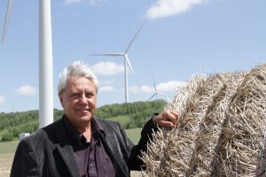 School trustee touches hay